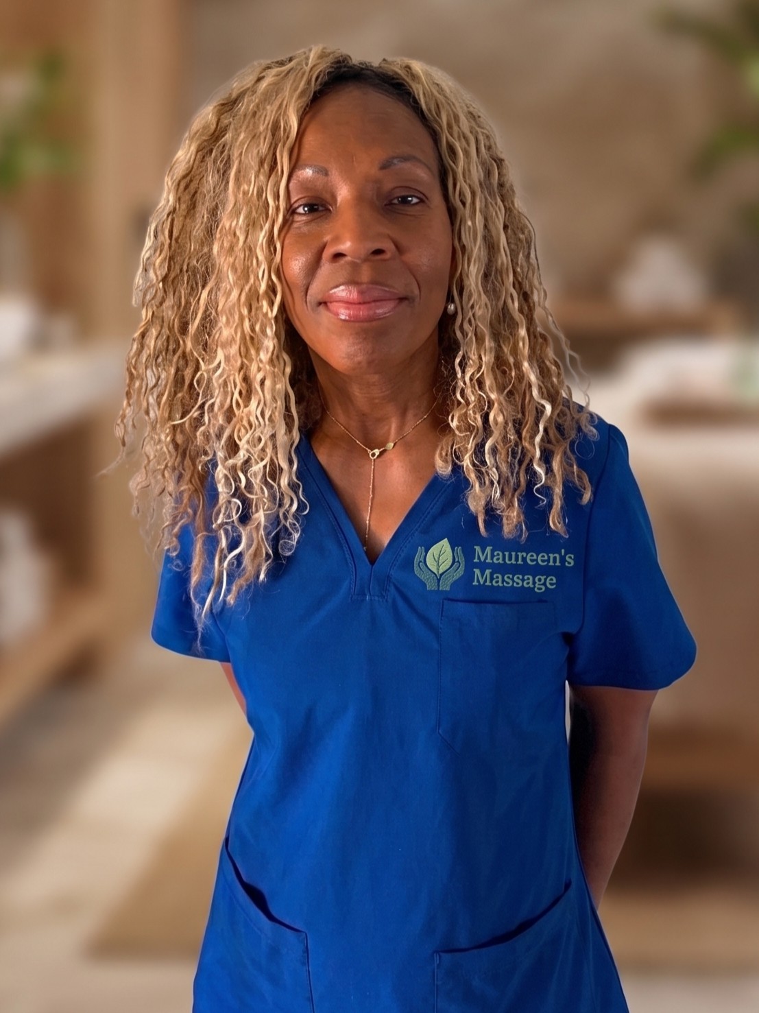 Maureen Reid, licensed massage therapist, in her studio scrubs.
